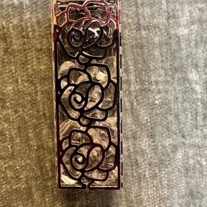 Silver pendant with rose designed cage full of crystals